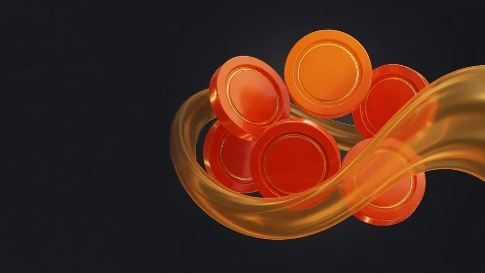 An amber wave curling around orange spin tokens on a graphite surface
