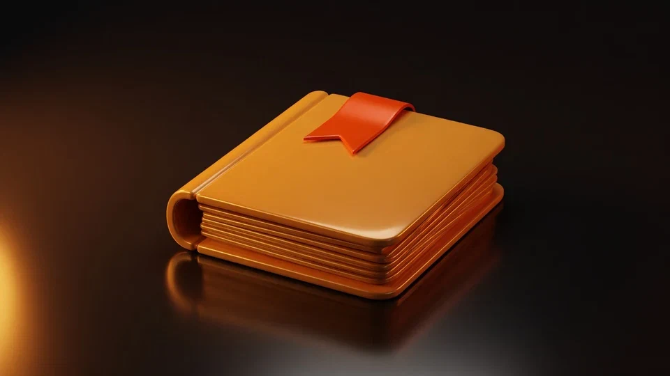 Amber book and orange bookmark on a dark surface