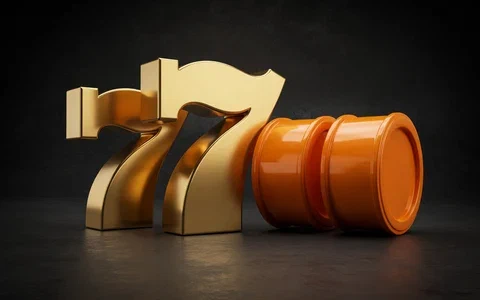 Golden slot symbols beside orange reels